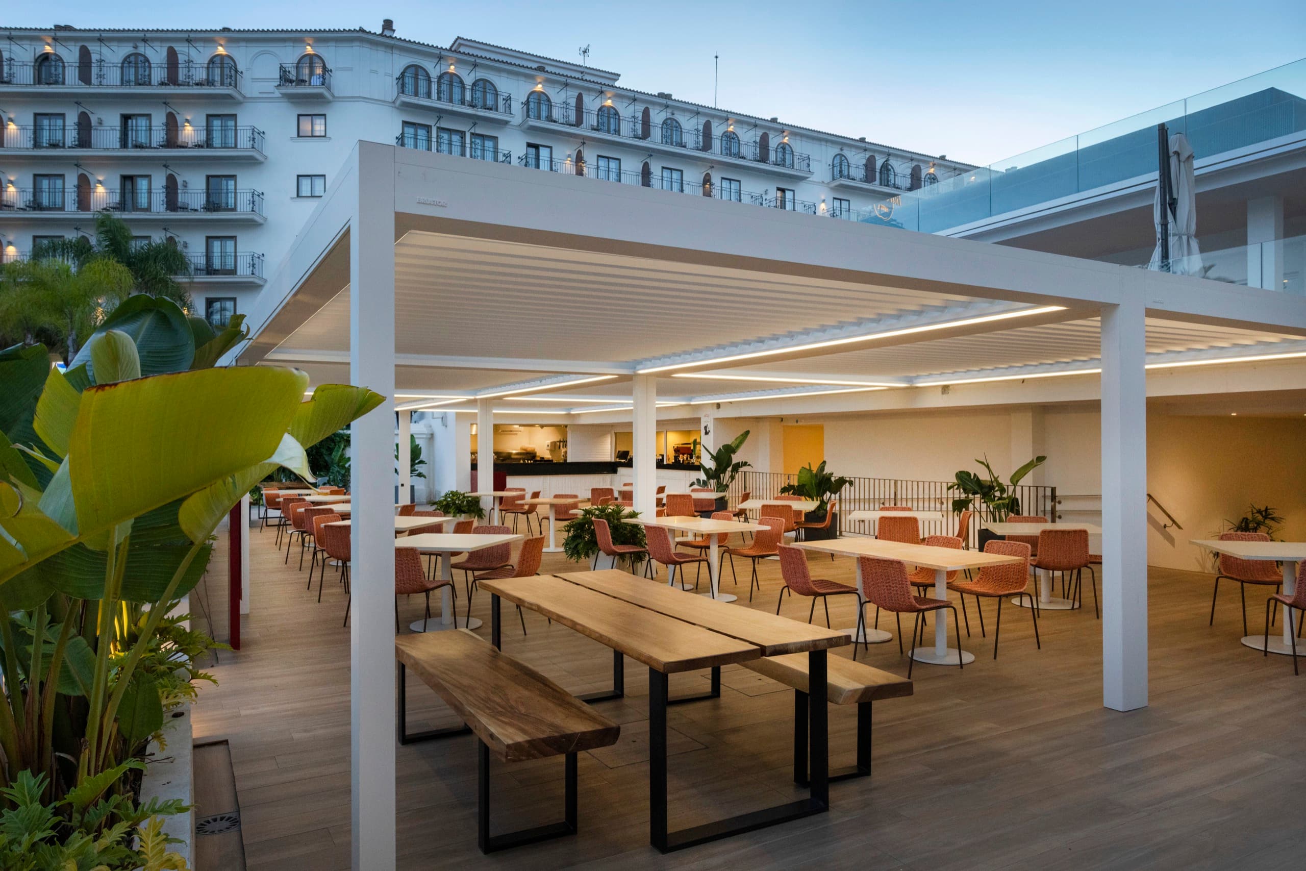Commercial outdoor living installation with covered dining