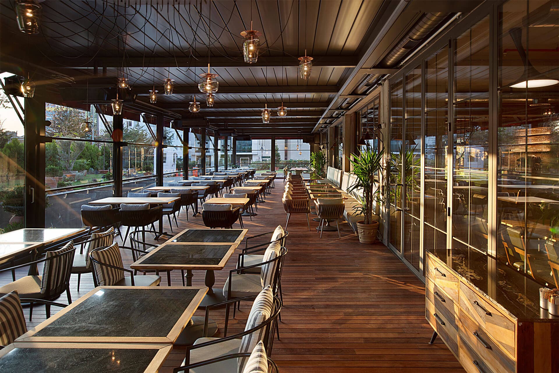 Family enjoying outdoor living space under motorized pergola
