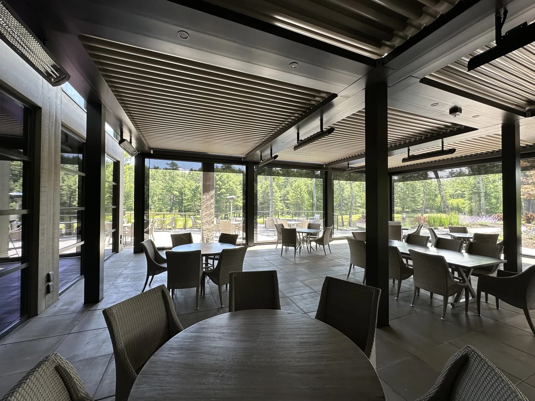 Louvered pergola and screens around a commercial dining patio