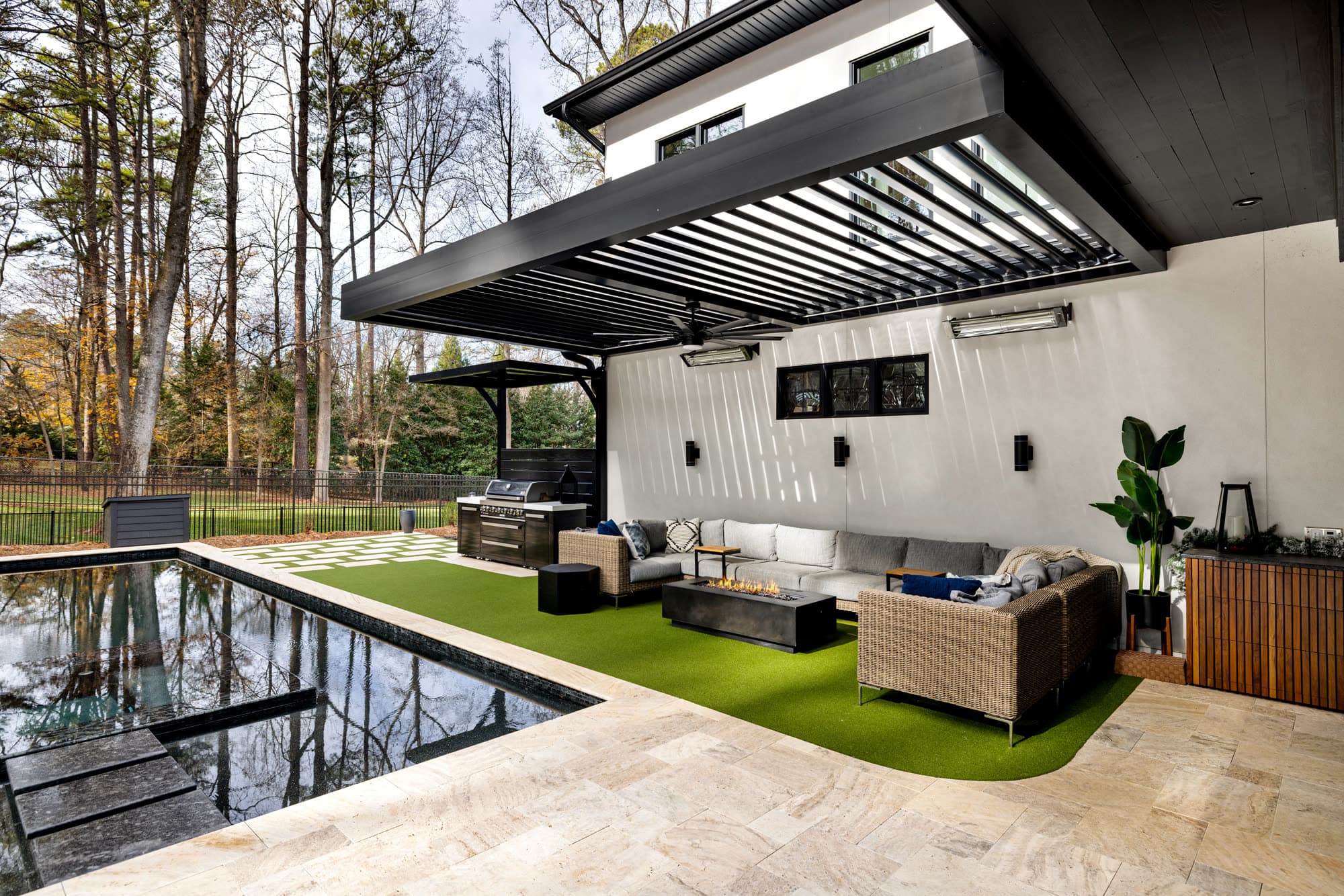 Pergola with integrated privacy screens and poolside location