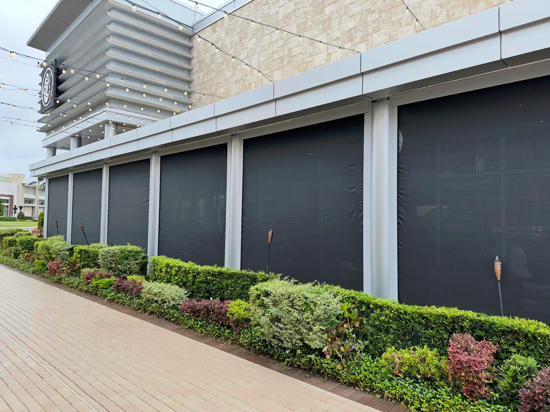 Motorized retractable screens installed on a Chicago commercial patio