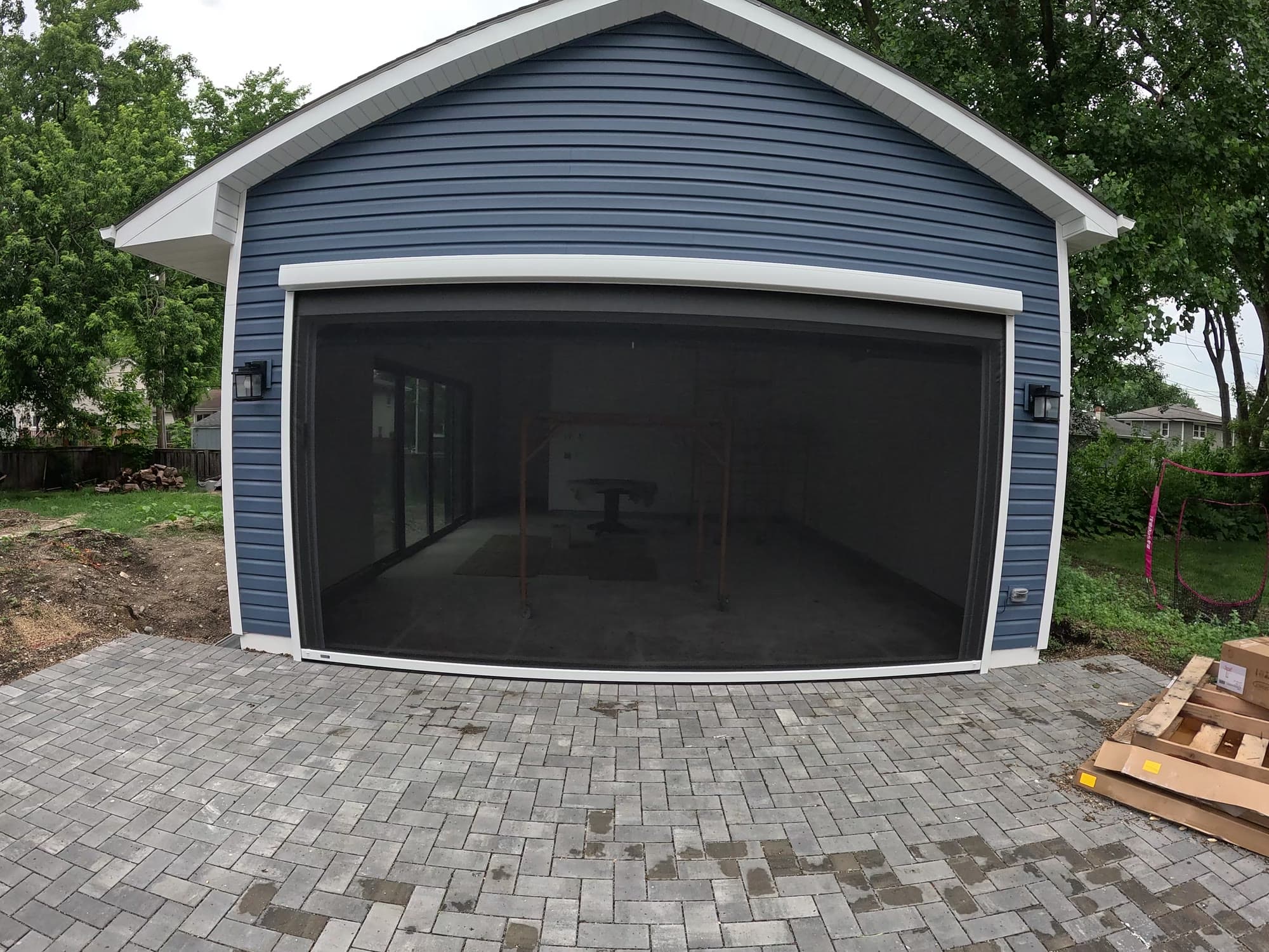 Closed Progressive Screens motorized insect screen on a Bartlett garage opening